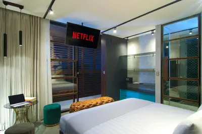a bedroom with a bed and a sign that reads mercury at 4BR Villa Kamis - Minggu Villas Seminyak in Seminyak