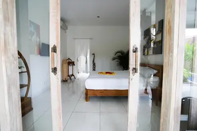 a bedroom with a bed in a room at Villa Polly in Seminyak