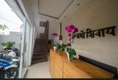 a room with a counter with flowers on it at Cozy Umalas Guesthouse in Kerobokan