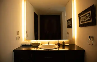 a bathroom with a sink and a large mirror at Villa Sunset by Premier Hospitality Asia in Nusa Dua