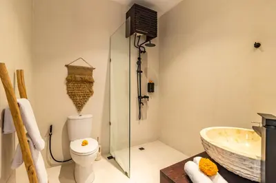 a bathroom with a sink and a toilet and a tub at NEWLY RENOVATED trendy 4bd Pvt villa in Seminyak in Seminyak