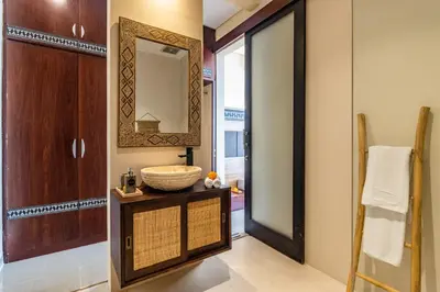 a bathroom with a sink and a mirror at NEWLY RENOVATED trendy 4bd Pvt villa in Seminyak in Seminyak