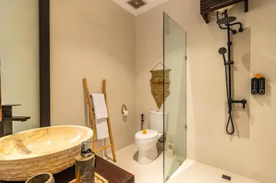 a bathroom with a bath tub and a toilet at NEWLY RENOVATED trendy 4bd Pvt villa in Seminyak in Seminyak