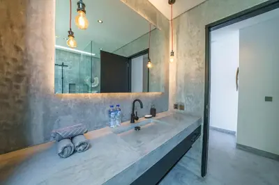 a bathroom with a sink and a large mirror at Villa Bali Townhouse 3 - Modern 2BR Villa with pool - PERFECT LOCATION in Canggu