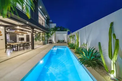 a swimming pool in the backyard of a house at Villa Bali Townhouse 3 - Modern 2BR Villa with pool - PERFECT LOCATION in Canggu