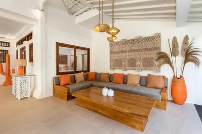 a living room with a couch and a coffee table at Villa Lisabella by Villa Finder in Seminyak