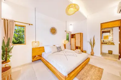 a bedroom with a bed in a room at Villa Dublin - Luxury 5 BDR w Jacuzzi & Pool in Seminyak