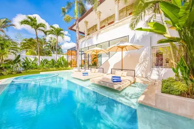 an exterior view of a villa with a swimming pool at Villa Dublin - Luxury 5 BDR w Jacuzzi & Pool in Seminyak