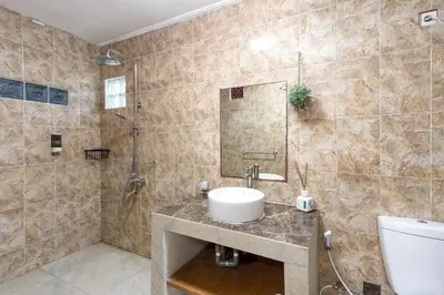 a bathroom with a sink and a shower at Villa Yati in Seminyak