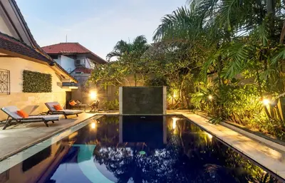 a swimming pool in the backyard of a house at Villa Yati in Seminyak