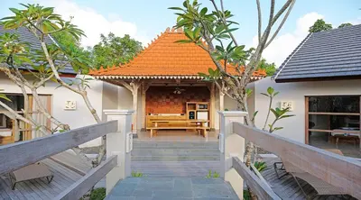 a house with an orange roof and stairs leading to it at Vivara Bali Private Pool Villas & Spa Retreat in Jimbaran
