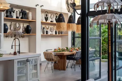 a kitchen and dining room with a table and chairs at Villa Yukiko Canggu in Canggu