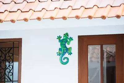 a green seahorse on a wall next to a door at Villa Sintra - 2 BR luxury in tranquil location, walk to beach in Seminyak