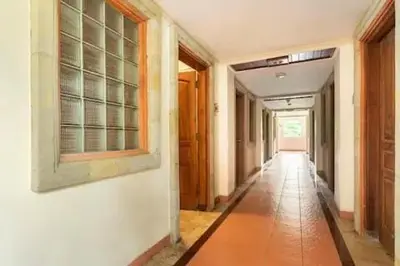 an empty hallway of a house with a window at Jayakarta Residence - Sandy Sunset Suite 1BR - 6432 in Seminyak