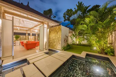 a house with a swimming pool and a patio at PROMO 4 bd Spacious villa in strategic location in Seminyak