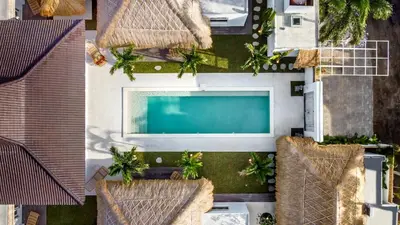 an overhead view of a house with a swimming pool at Villa Surga Blue by Alfred in Bali in Seminyak