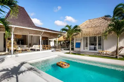 a boat in the swimming pool of a villa at Villa Surga Blue by Alfred in Bali in Seminyak