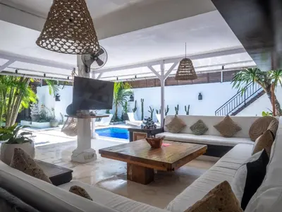 a living room with a couch and a table at Ocean Star 1 in Seminyak