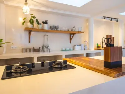 a kitchen with a stove and a counter top at Ocean Star 1 in Seminyak