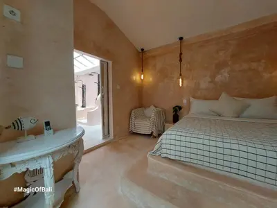 a bedroom with a bed and a window at Ocean Star 3 in Seminyak