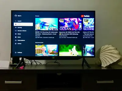 a flat screen tv sitting on top of a desk at Private Apartment inside Beach Resort Jayakarta in Seminyak