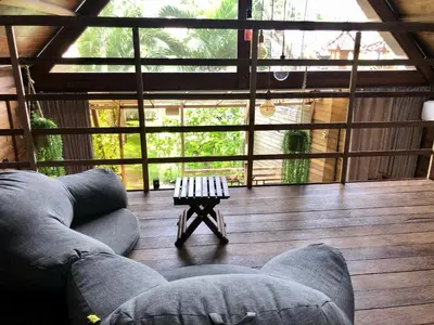a living room with a couch and a table at Bali WOW! Bungalows, Nusa Dua Benoa in Nusa Dua
