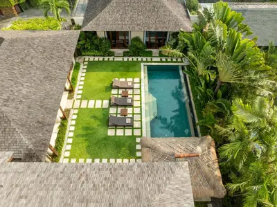 an aerial view of a backyard with a swimming pool at The Suar Seminyak by Nakula in Seminyak