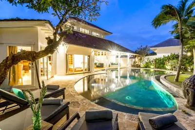 a swimming pool in the backyard of a house at La Villa Oberoi (6 BR) in Seminyak