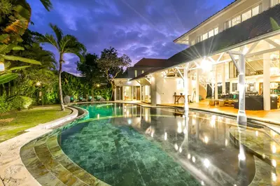 an image of a swimming pool in front of a house at La Villa Oberoi (6 BR) in Seminyak