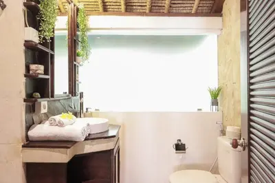 a bathroom with a sink and a toilet at Villa Tunjung Batubelig Canggu in Canggu