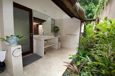 a bathroom with a sink and a mirror at Villa Elleo in Seminyak