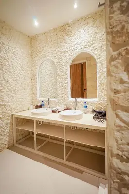 a bathroom with two sinks and a mirror at Bias Villa Seminyak in Seminyak