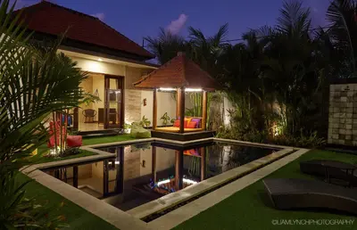 a house with a swimming pool in the yard at Villa Jae in Seminyak