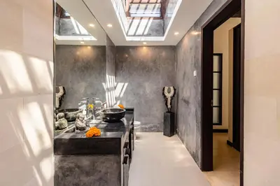 a kitchen with a black counter top in a room at PROMO Tropical 3 BD Villa with office and parking in Kerobokan