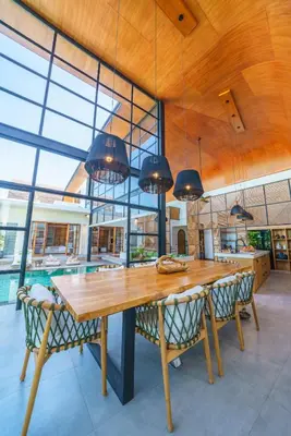 a large dining room with a wooden table and chairs at Villa Mango 3 - Amazing 4-bdr Villa in Berawa ! PERFECT LOCATION ! in Canggu