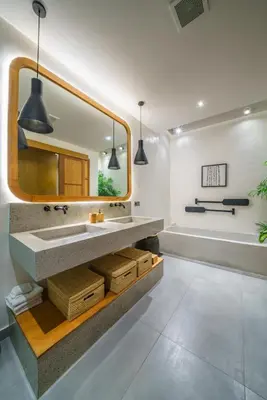 a bathroom with a sink and a mirror and a tub at Villa Mango 3 - Amazing 4-bdr Villa in Berawa ! PERFECT LOCATION ! in Canggu