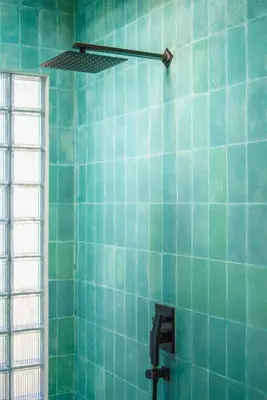 a blue tiled bathroom with a sink and a window at Villa Mango 3 - Amazing 4-bdr Villa in Berawa ! PERFECT LOCATION ! in Canggu