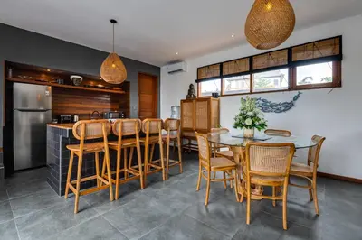 a kitchen and dining room with a table and chairs at 2 Zen Bali Villa Canggu in Canggu