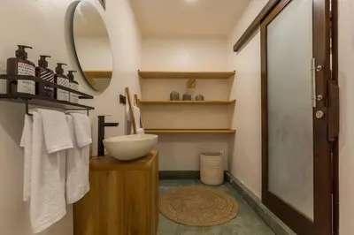 a bathroom with a sink and a mirror at Charming 3 Bedrooms Villa Beach Walking Distance in Seminyak