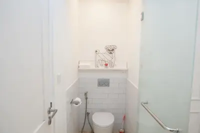 a small white bathroom with a toilet in it at PEKO VILLA - 1 BED - SEMINYAK in Seminyak