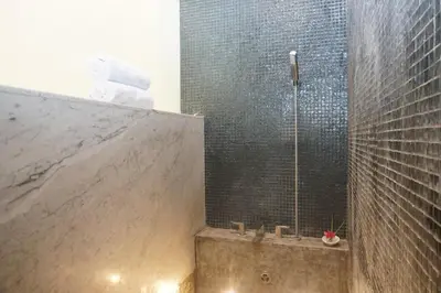 a bathroom with a shower with a tub at PEKO VILLA - 1 BED - SEMINYAK in Seminyak