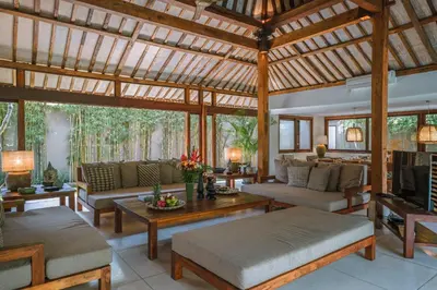 a large living room with a large wooden ceiling at Villa Amore - Elegant 4-br Villa close to the beach in Canggu