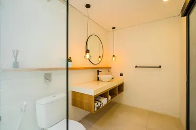 a bathroom with a toilet and a sink at 4 Bdr -Villa Donna, Fast Wi-Fi & Private Pool in Canggu