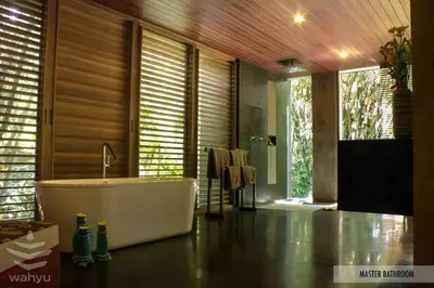 a bathroom with a bath tub in a room at Wahyu wonderful 2Bd villa with huge garden and large pool in Seminyak