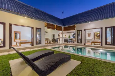 a house with a swimming pool in the yard at Central 4 bedr villa 5min walk from eat street&Beach in Seminyak
