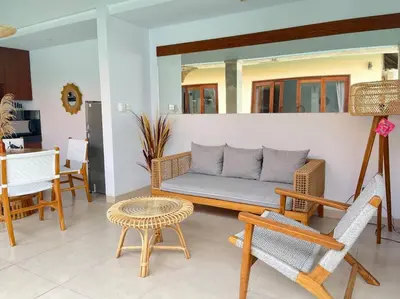 a living room with a couch and chairs and a table at Cosy and Cheerful 2 Bedroom villa 5mins to Finns in Canggu