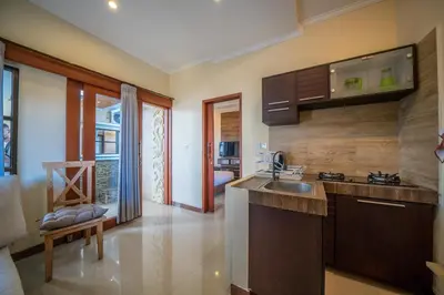 a kitchen with a sink and a counter at Padma Lodge Legian in Seminyak