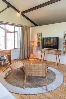 a living room with a couch and a television at Villa Elma - Huge 2-bedroom pool villa in Umalas! in Seminyak