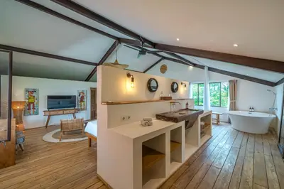a bathroom with a tub and a sink and a bath room at Villa Elma - Huge 2-bedroom pool villa in Umalas! in Seminyak