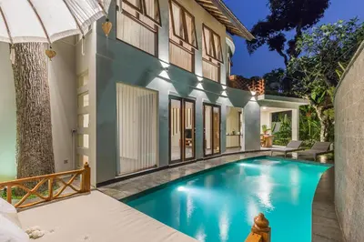 a swimming pool in the backyard of a house at Ajiorqo Villa in Seminyak